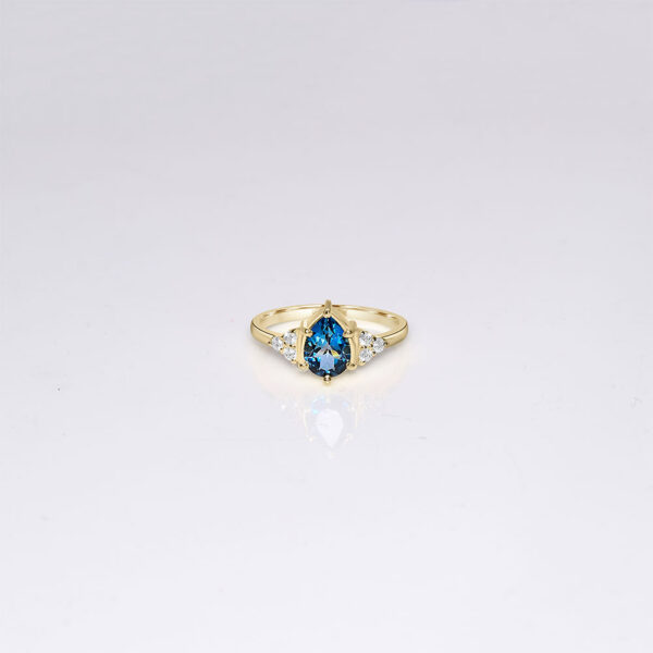 14k gold london blue topaz engagement ring with side diamonds