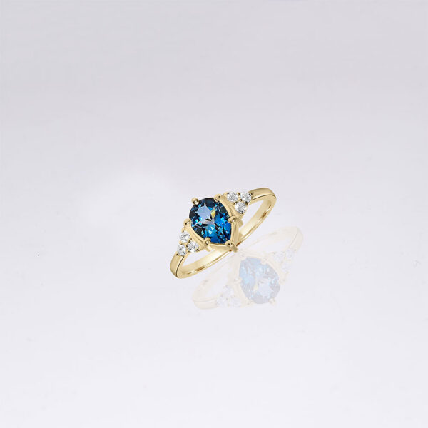 14k gold london blue topaz engagement ring with side diamonds