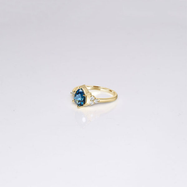 14k gold london blue topaz engagement ring with side diamonds